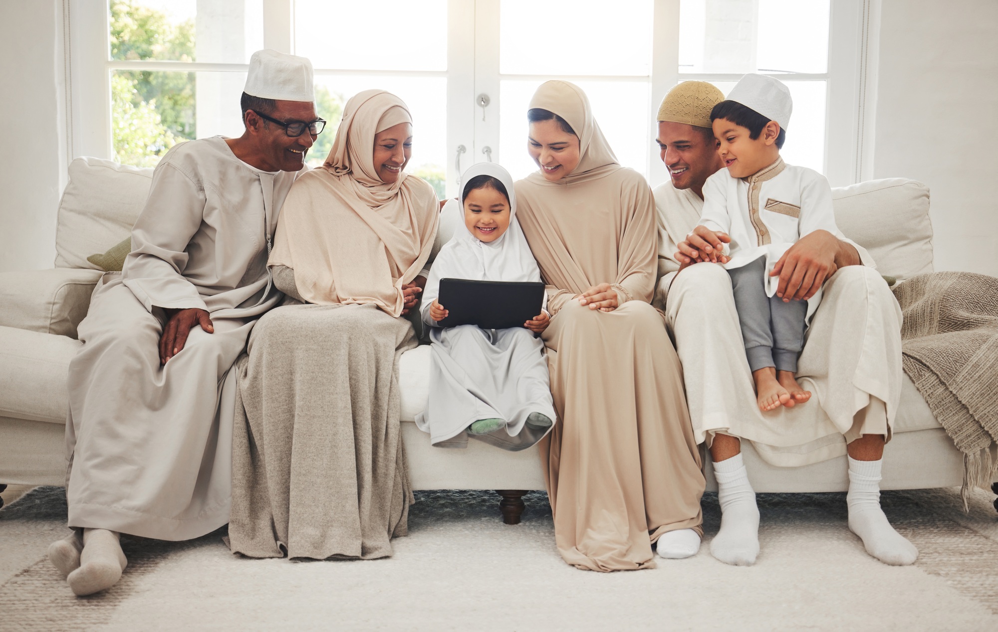 Happy family, Muslim parents or kids with tablet for elearning, Islamic info or studying in Allah o