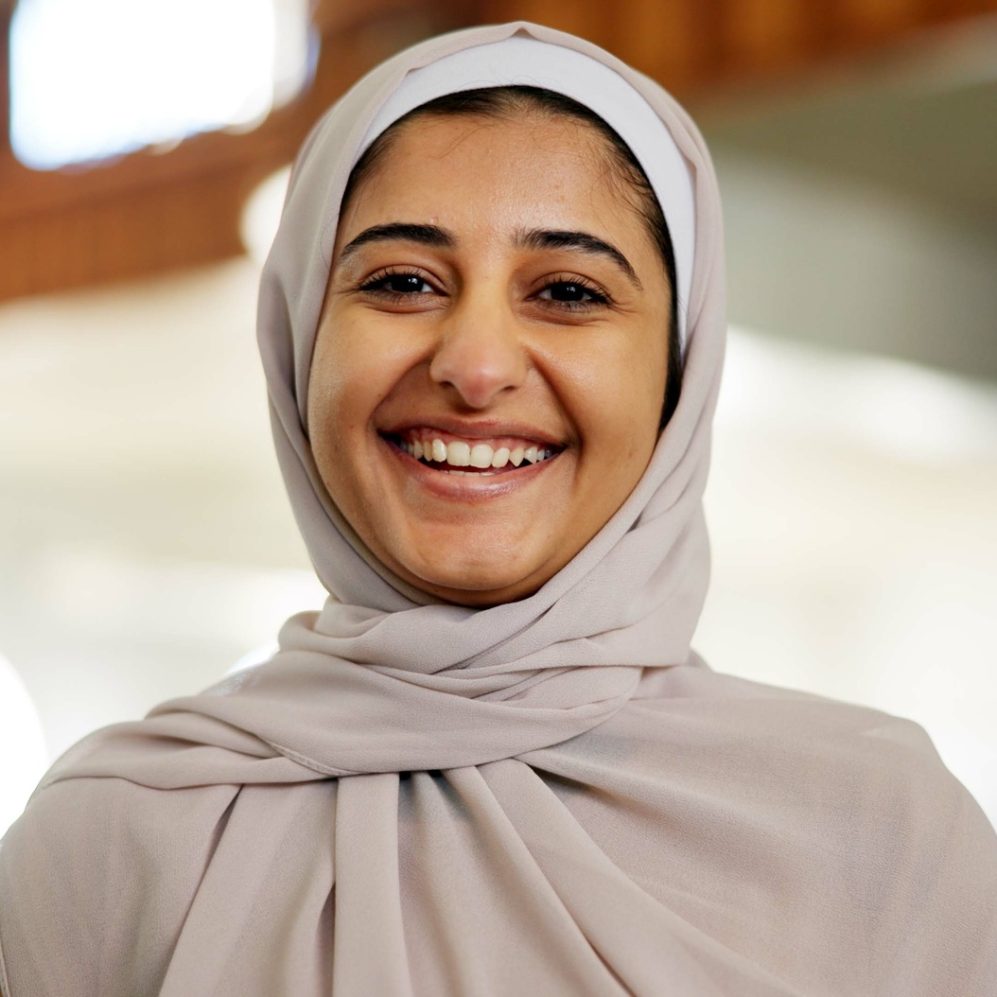 Laugh, islam and portrait of woman in mosque for praying, worship and muslim religion. Eid Mubarak,