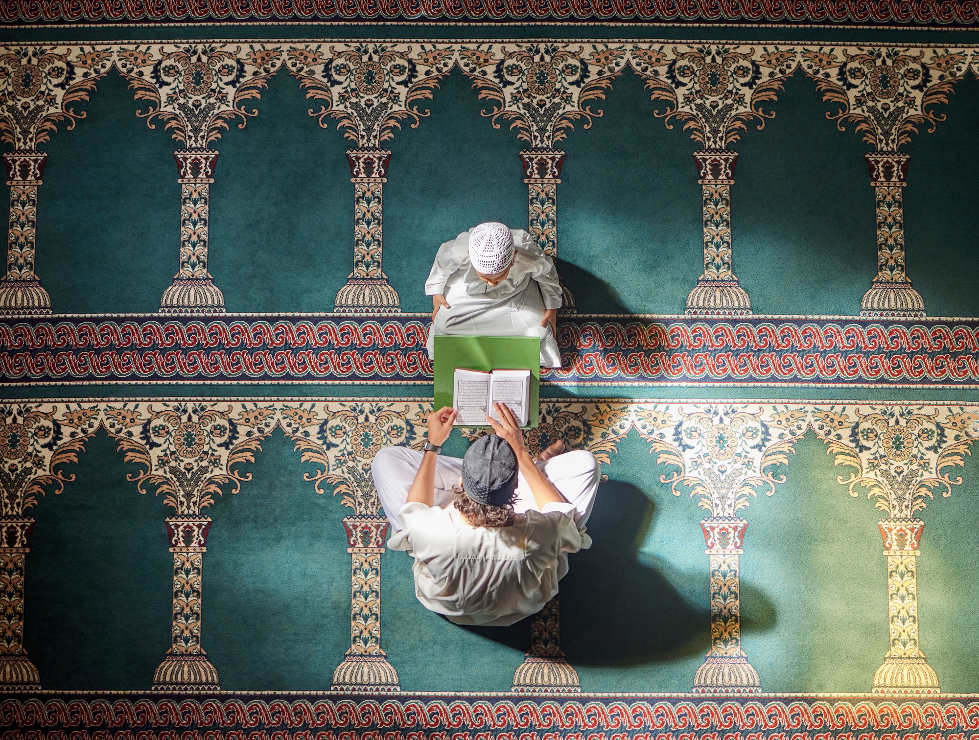 Muslim pray, child or man in praying with Quran for peace, mindfulness or support from Allah in hol