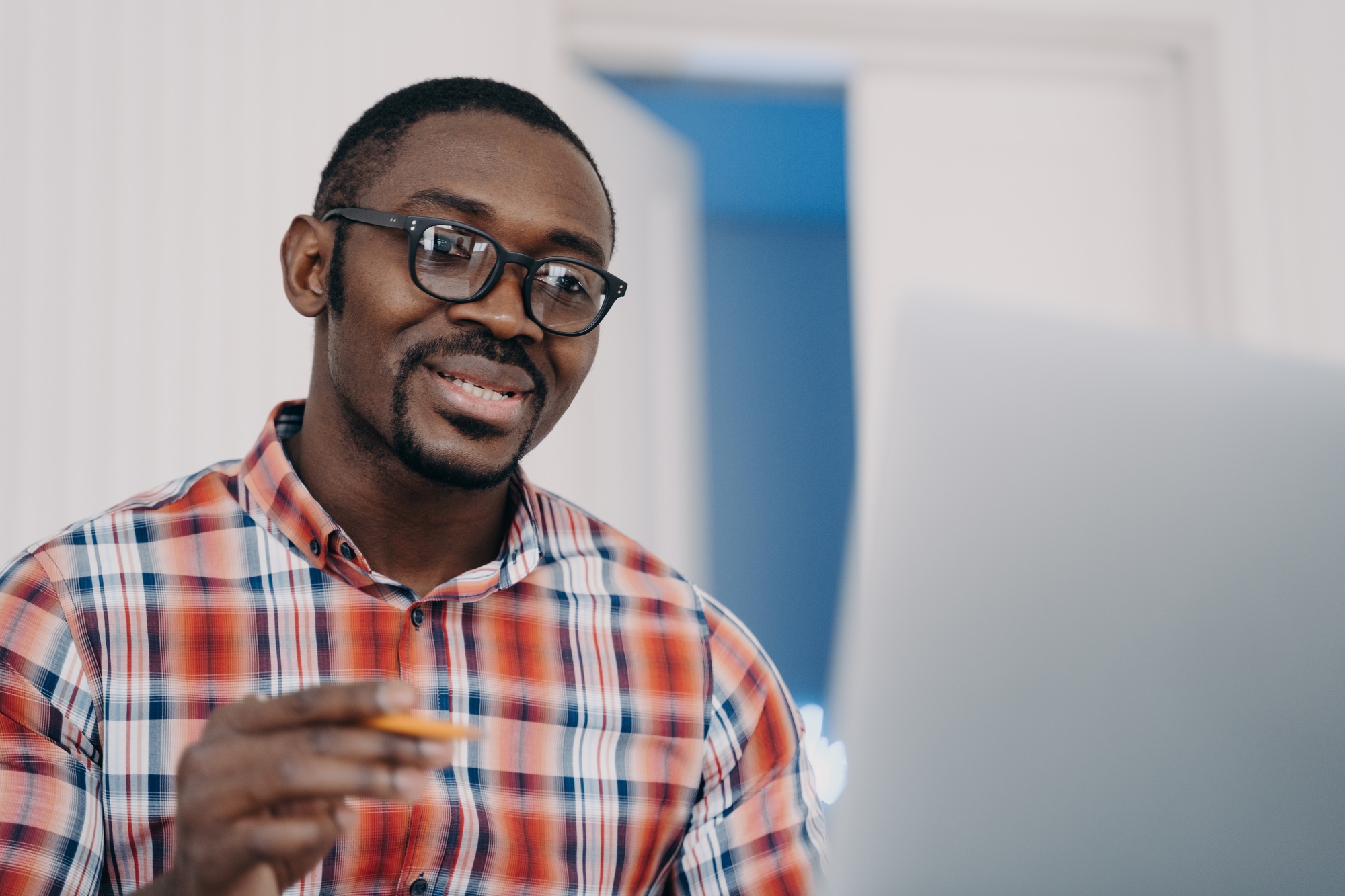 positive-afro-man-in-glasses-has-online-conference-on-pc-distance-learning-online-courses-