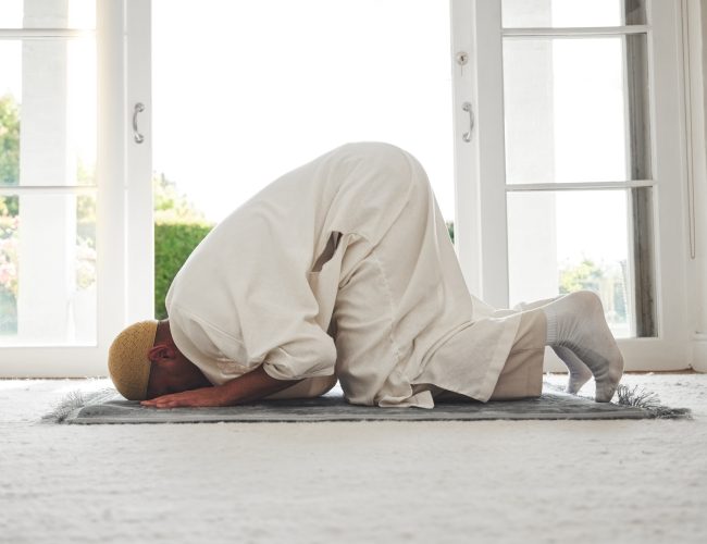 prayer-muslim-and-islamic-with-man-on-living-room-floor-for-eid-mubarak-god-and-worship-quran-h