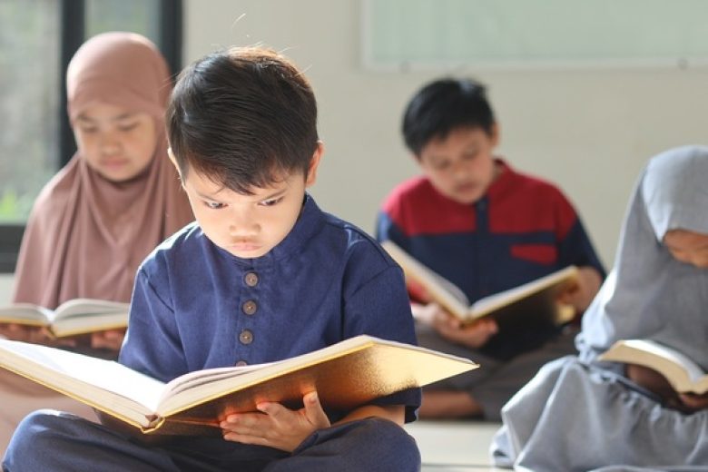 little-kid-sitting-in-front-and-focus-reading-kor_cropped