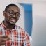 positive-afro-man-in-glasses-has-online-conference-on-pc-distance-learning-online-courses-