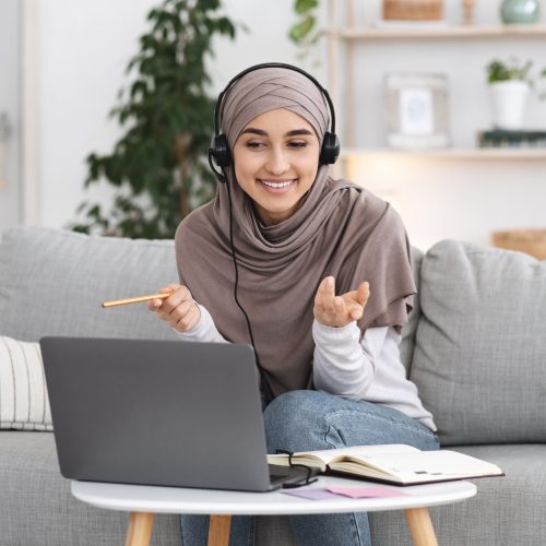 online-tutoring-young-muslim-woman-teacher-having-video-call-with-students