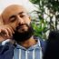 Arab entrepreneur discussing company growth strategy in videocall