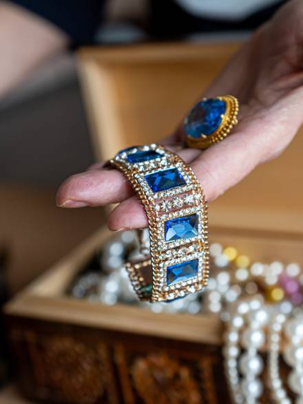 wooden-treasure-chest-with-valuables-a-female-hol-2025-03-14-17-45-29-utc