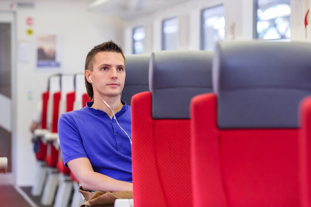 Young man traveling by train